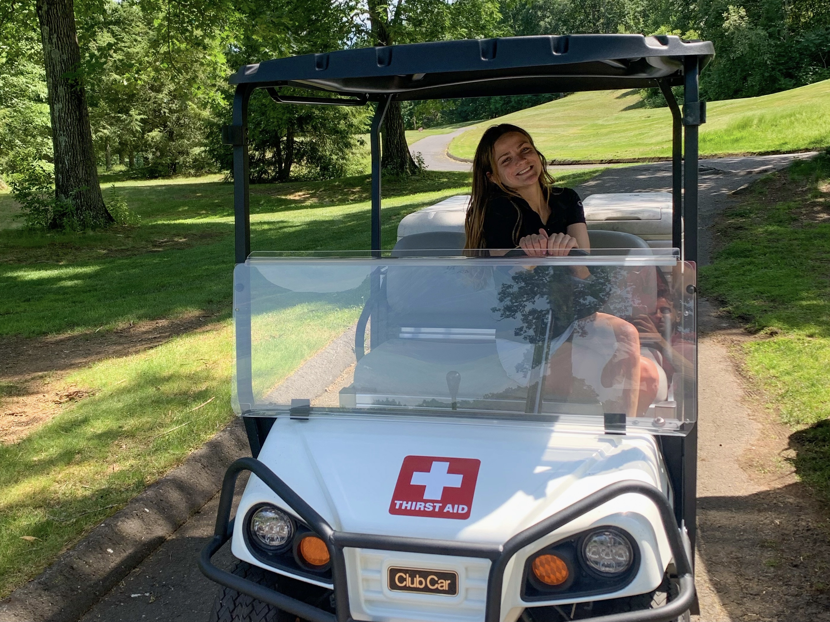 A golf cart and rider