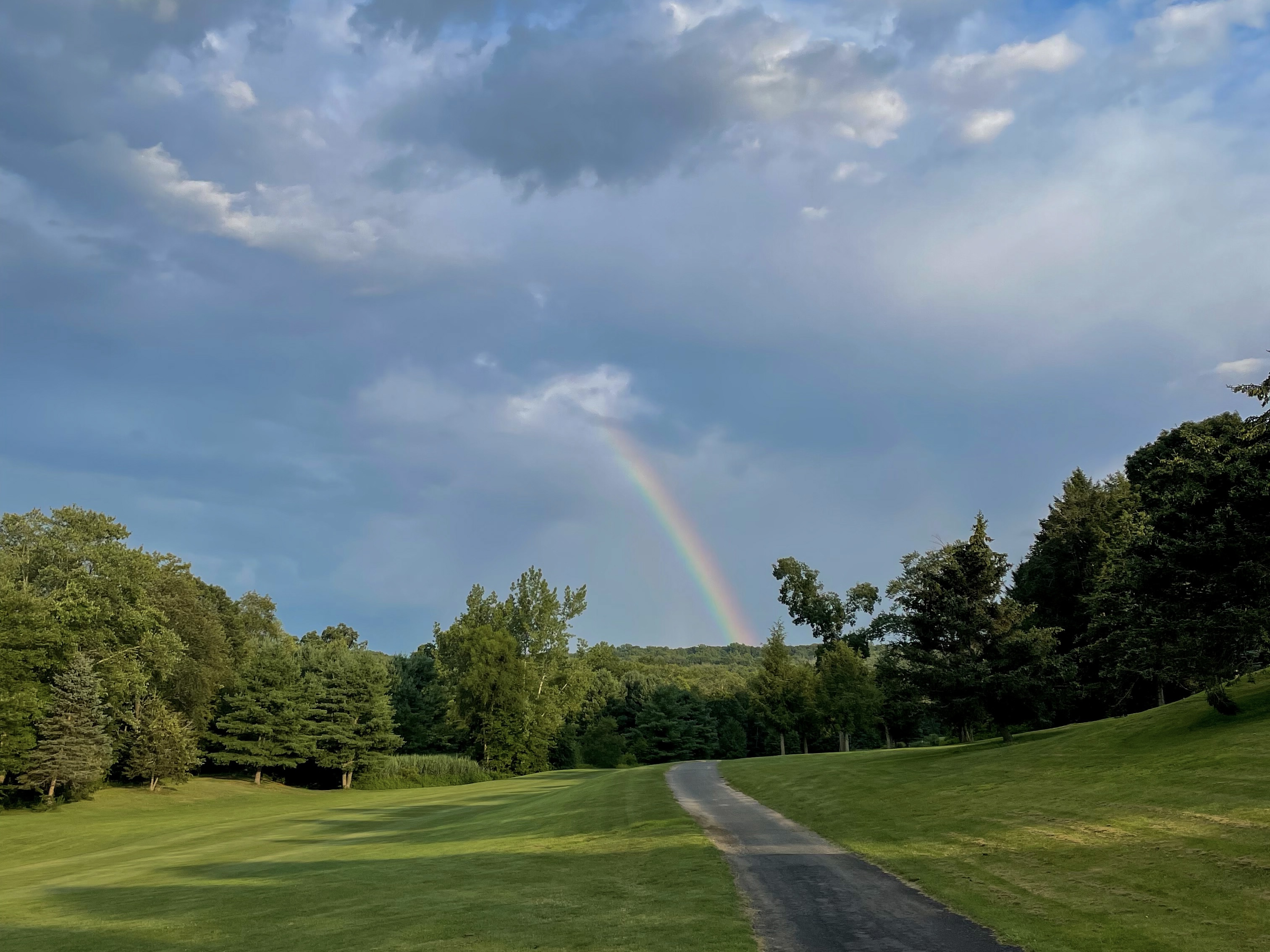 a rainbow is seen over the course